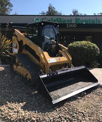 Cat 988b wheel loader loading marble blocks on trucks. New Cat 289d3 Track Loader Cal West Rentals