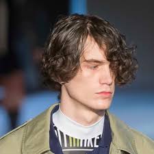 All those kinks can create an over abundance of natural volume and at times, prevent your hair from hanging down. The Top Curly Hairstyles From The Men S Runway