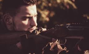 Hunting in spring forest hunter with shotgun gun