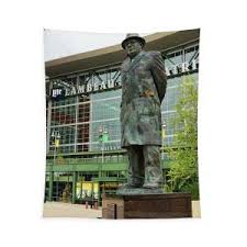 To further encourage community members to wear face masks, and to show support to those on the front lines, face masks were installed on the curly lambeau and vince lombardi statues in front of the lambeau field atrium. Vince Lombardi Statue At Lambeau Field 4430 Tapestry For Sale By Jack Schultz
