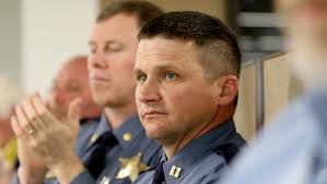 Police captain charged with domestic violence, put