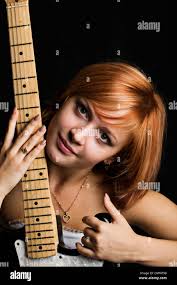 Beautiful girl playing guitar hi-res stock photography and images