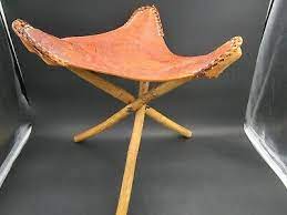 An original pair of french bar stools with brown camel colored leather. Post 1950 Vintage Tool Leather Vatican