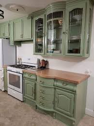 I have been thinking about our built in desk in the kitchen. A China Cabinet Repurposed As Upper And Lower Kitchen Cabinets In 2020 Upper Kitchen Cabinets Repurposed Kitchen Repurposed China Cabinet
