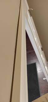 Both the sleeve anchor and tapcon® allow door frames to be placed in position, leveled and plumbed before the anchor is inserted through the door frame. Gap Between Wall And Door Frame How To Fix This Is This Normal Home Builder Told Me Its Fine Howto