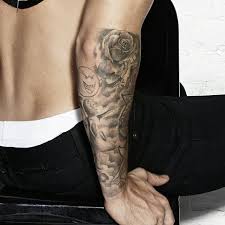 Justin Biebers Rose Tattoo On The Right Elbow Justin Bieber Tattoos Justin Bieber Tattoos Sleeve Best Sleeve Tattoos