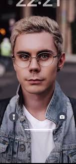 Smart Guy with Glasses Eating Apple