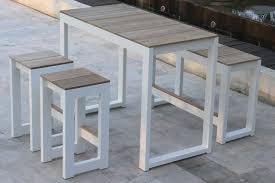 Emerit patio bar tables, outdoor bistro bar height table, metal frame tempered glass table high top. Bermudafied Bar Collection