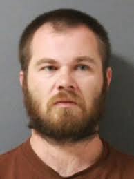 Man charged after allegedly burning child's wrist