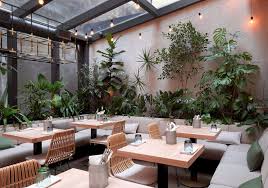Jungle Cafe Natural Interior Design Of A Cafe With Greenery And Beautiful Lighting Natural Interior Design Cafe Interior Design Natural Interior