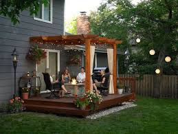 A simple bridge crosses the stream leading to this cute little porch sitting area. 5 Back Porch Ideas Designs For Small Homes Outdoor Pergola Pergola Wood Pergola