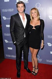 Miley Cyrus Appears As Though She S Wearing A Bra On The Red Carpet As Slips On A Revealing Minidress Liam Hemsworth And Miley Liam Hemsworth Miley Cyrus