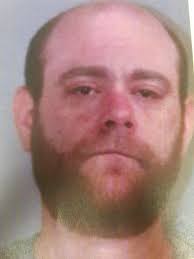 FROM THE NEWSROOM: (KILLINGLY) A Thompson man driving in the wrong  direction was found to be intoxicated, carrying several firearms, and  wanted in question for a burglary in Putnam, say State Police.