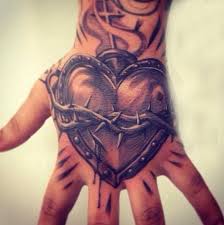 Whether it's a life like heart or a whimsical heart that you would draw when saying i <3 you. 200 Sacred Heart Tattoo Designs For Men And Women Update 2021 Hand Tattoos For Guys Sacred Heart Tattoos Hand Tattoos