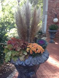 Pampas Grass Plumes And Birch Stems Are The Center Focal Point Of This Fall Container Arrangement Desi Fall Container Gardens Container Flowers Fall Planters