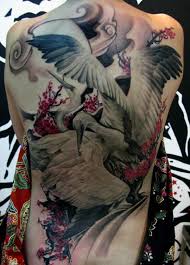 Red sun and flying crane tattoos design. 61 Incredible Crane Tattoos