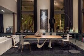 The shape of the table is organic and very cozy. Extendable Or Fixed Table With Glass Wood Marble Or Ceramic Top Idfdesign