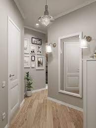 Light grey hallway with white trim. A Light Grey And White Hallway Looks Bright And Friendly I Especially Like The Colou Living Room Colors Living Room Design Modern Interior Design Living Room