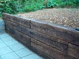 How To Build A Retaining Wall With Railway Sleepers Building A Retaining Wall Sleeper Retaining Wall Sloped Garden