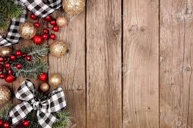 Check spelling or type a new query. Christmas Side Border With White And Black Checked Buffalo Plaid Ribbon Decorations And Branches Overhead On A Rustic Wood Background Stock Photo Picture And Royalty Free Image Image 134115368