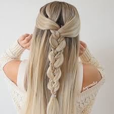 Start by twisting two sections of hair from either side of the head and fastening them in the middle. Easy Braid Hairstyle Braided Hairstyles Easy Hairstyles With Curled Hair Easy Curled Hairstyles