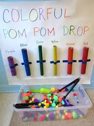 Colourful Pom Pom Drop From Ascy Hamilton Enhances Children S Cognitive Social And Fine Motor Boredom Busters For Kids Preschool Fine Motor Preschool Colors