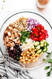 Spoon couscous into a large bowl; Greek Couscous Salad Garnish Glaze