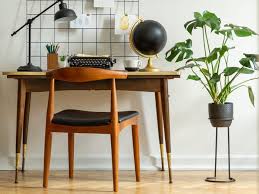 Light its décor with a modern fireplace illuminating pockets of wood. How To Make Home Look Midcentury Modern For Cheap According To Designers