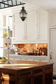 Plain White Cabinets Are Glamed Up With A Polished Copper Backsplash Traditional Kitchen Design Kitchen Inspirations Kitchen Design