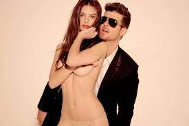 Model Emily Ratajkowski alleges that singer Robin Thicke fondled her bare  boobs while filming blurred lines video