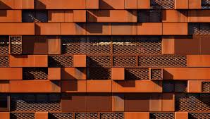 Corten is a structural steel it has a higher tensile strength to other everyday steel perfect for peroforated flooring, fencing and public sculptural pieces Expanded Mesh Perforated Cladding Proteus Sc Proteus Facades