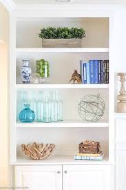 Learn how to decorate a bookshelf and create a stunning display worthy of your favorite titles. How To Decorate Bookshelves Green With Decor