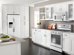 The White Cabinets Paired With The Stainless Steel Whirlpool Kitchenaid Ice White Appliances Kitchen Suite White Kitchen Appliances Outdoor Kitchen Countertops