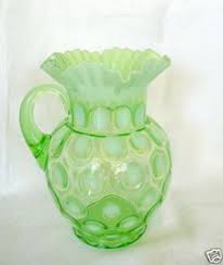 A victorian uranium yellow vaseline glass epergne vase with wave ribbed pattern, opalescent white rim, and silver plated metal base. 36 Vaseline Glass Ideas Vaseline Glass Vaseline Glass