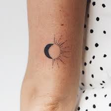 It is also just a cool looking tattoo so when someone sees your matching sun. 75 Suuuuuuuper Tiny Tattoos That Even Your Grandma Will Approve Of Astronomical Tattoo Sun Tattoos Sun Tattoo