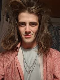 This is an old photo of me. Although clothes don't make the man, this shows  how easy it is for me to change my appearance to conform with society's  expectations. Unfortunately, it