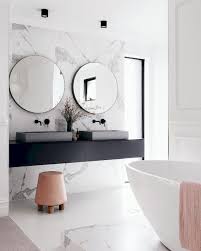 The vanity mirror, inset with shagreen leather, adds a luxurious touch. 93 Cool Black And White Bathroom Design Ideas 21 Oneonroom White Bathroom Designs Bathroom Design Inspiration Marble Bathroom Designs