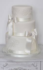 Elegant Ivory 3 Tier Wedding Cake With Satin Bows And Lace Detail Bow Wedding Cakes Lace Wedding Cake 3 Tier Wedding Cakes