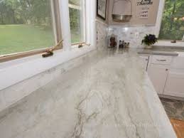 sea pearl quartzite with white cabinets