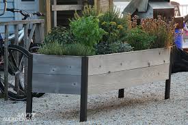 Raised garden bed elevated wood planter box outdoor raised wooden planter garden grow box with legs, lockable wheels and storage. Elevated Raised Bed Gardening The Easiest Way To Grow