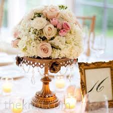 From pale pink to rose gold wedding dresses, be a blushing bride in any of these stunning pink wedding gowns and dresses. Rose Gold Wedding Flowers Center Pieces Flower Centerpieces Wedding Blush Centerpiece Gold Wedding Flowers