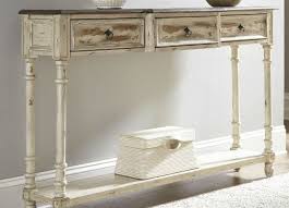 Sleek console table is featured at a tall counter height deep brown finish with gray trim under the tabletop What Is The Difference Between A Console Table And Side Table Living Spaces