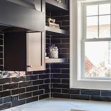 The best part about tiled backsplashes is that you don't need to tile your entire kitchen to make a statement. Glazed Black Horizontal Kitchen Backsplash Tiles Design Ideas