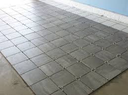 Our New White And Gray Porcelain Tile Garage Floor Installation Garage Floors Diy Garage Tile Garage Floor Tiles
