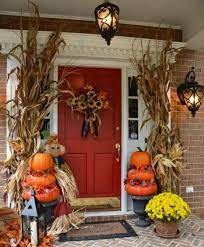The door decor is an easy diy project with a stencil, and the pumpkins can be found for wholesale prices at pumpkin patches. 52 Cozy Thanksgiving Front Door Decor Ideas Digsdigs