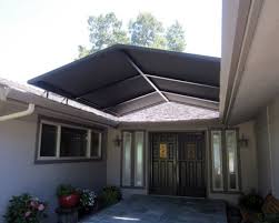Overhang house front canopy design. Modern Front Door Canopy Designs