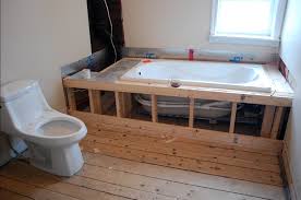A platform bathtub is enclosed in a framed platform and surfaced with tile, wood, or other finishing material. Build A Frame Around A Bathtub And Install Tiling For A Built In Bathtub If You Can Try To Make A Door Or Basement Bathroom Design Built In Bathtub Bathtub