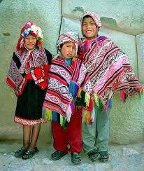This includes a variety of her well known designs in blouses, dresses, and accessories. Peruvian Kids Wearing Traditional Ponchos And Hats Fantasias