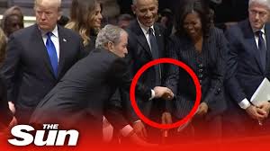 Bush then became a millionaire in the texas oil business and turned to politics, serving two bush junior told his dear old dad he'd bomb iraq just like he did. George W Bush Gives Michelle Obama A Cough Drop At His Dad S Funeral Youtube