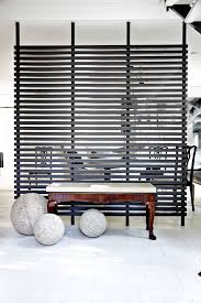 20 Clever Room Divider Ideas Folding Screen And Wall Partition Decorating Tips Diy a columned room divider for your home's entranceway to direct incoming traffic toward a particular area.